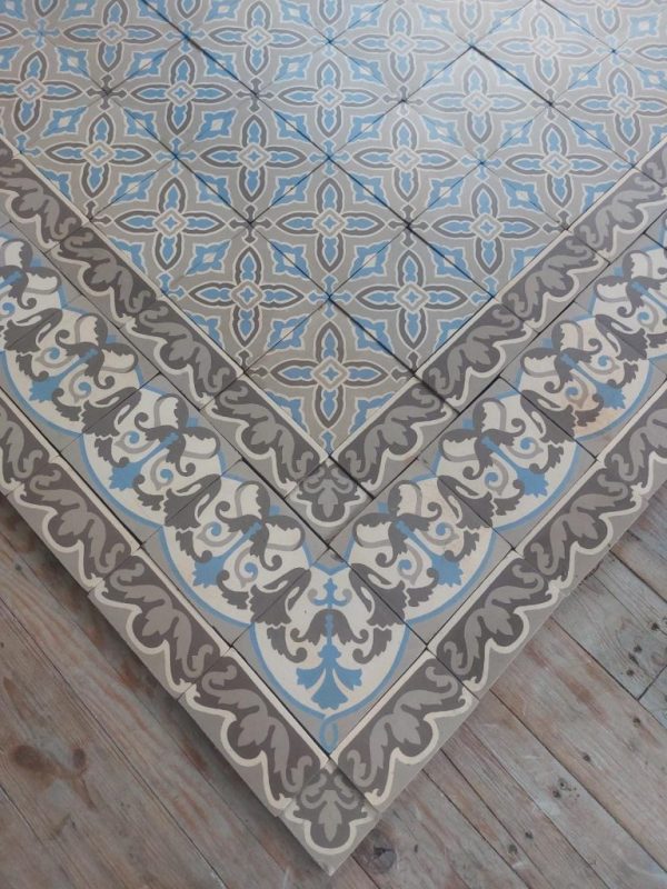 Antique ceramic floor with triple border in shades grey and blue