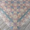 Antique reclaimed floor with pink and blue as dominant colors
