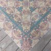 Old reclaimed ceramic floor with double border in matching colors pré 1910