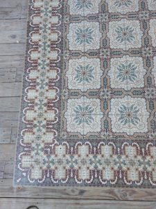 Faux mosaic encaustic floor tiles with matching borders, circa 1920–1930